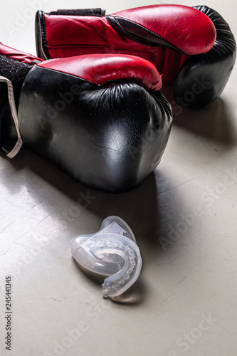 boxer teeth protection and pair of boxing gloves