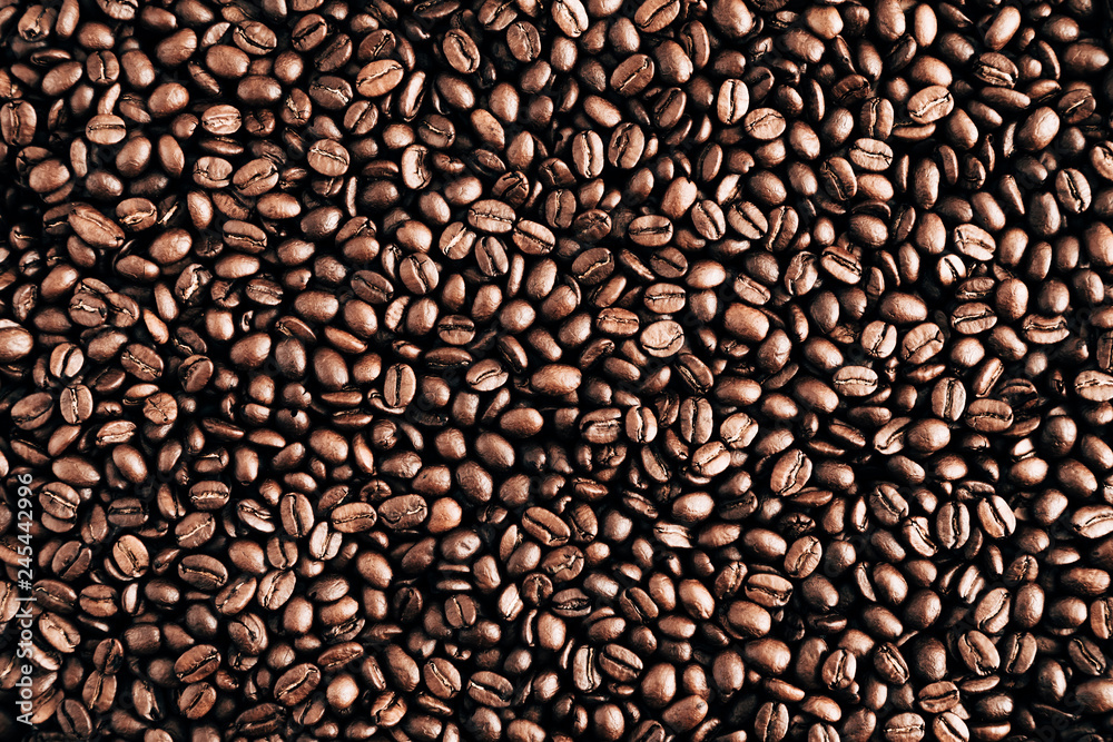 Roasted coffee beans background. Flat lay, top view
