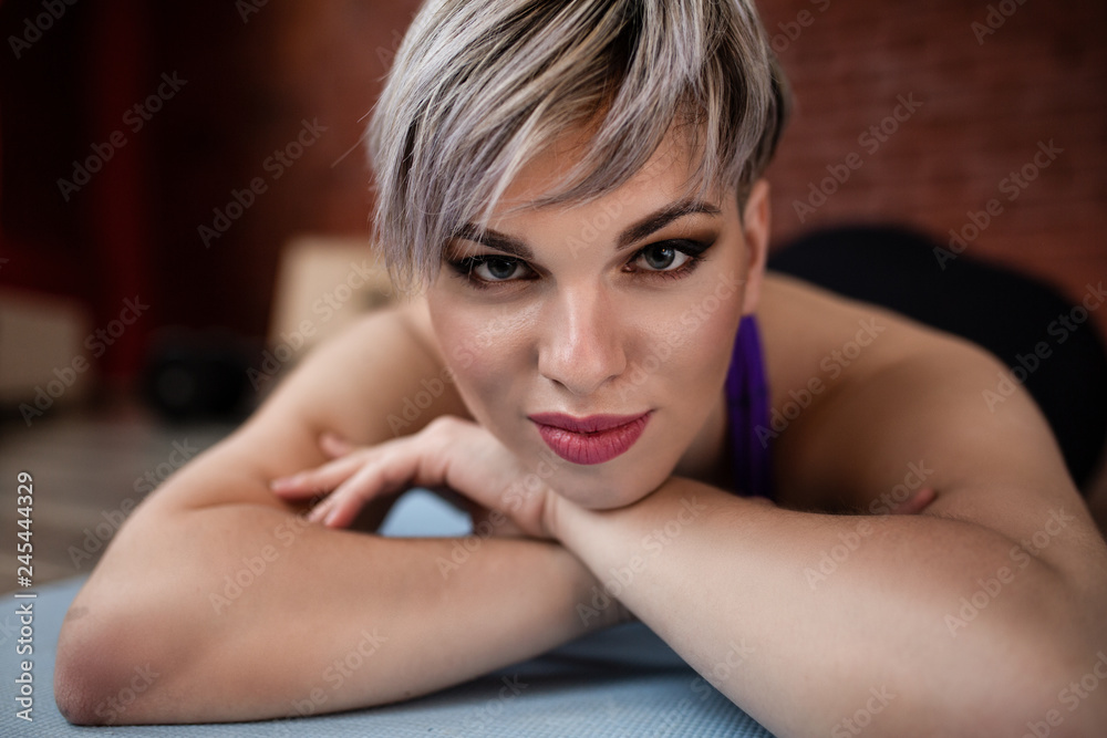 Obraz premium Beautiful fitness model girl posing wearing sport clothes. Girl in the sport concept. Portrait close up