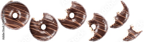 Chocolate glazed doghnut with chocolate milk lines on white background. High resolution image for food industry. photo