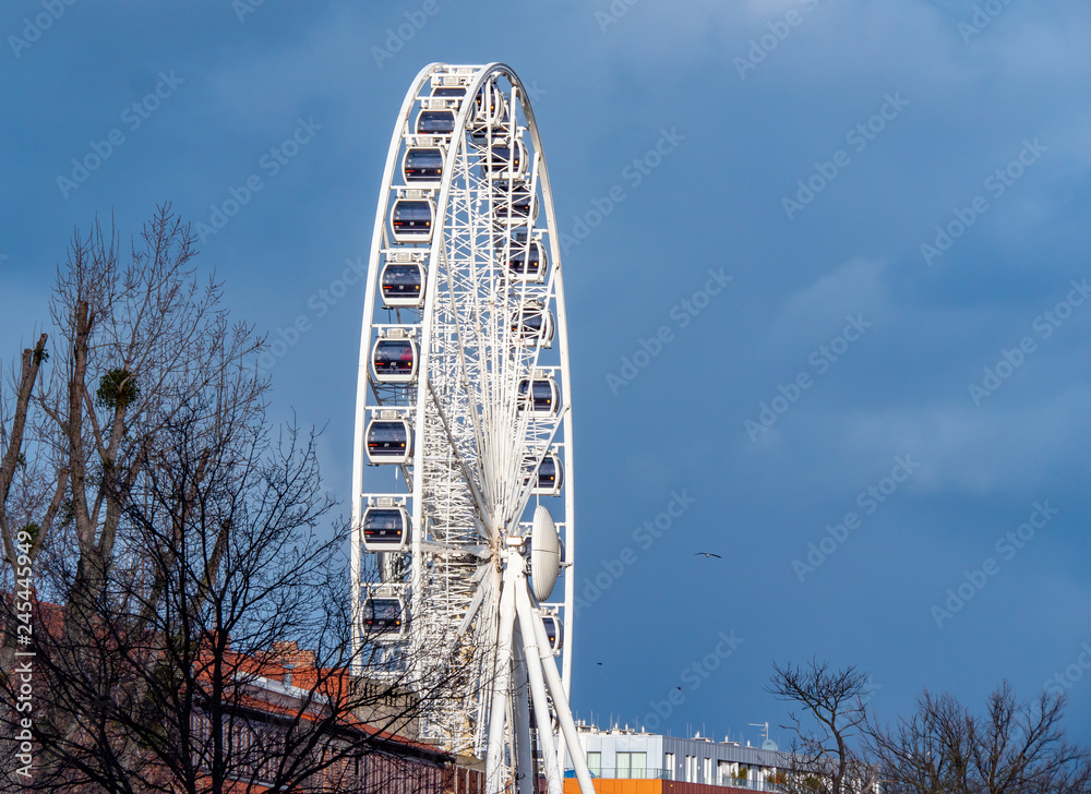 Gdansk, Poland , Ferris wheel  on a background of blue sky.