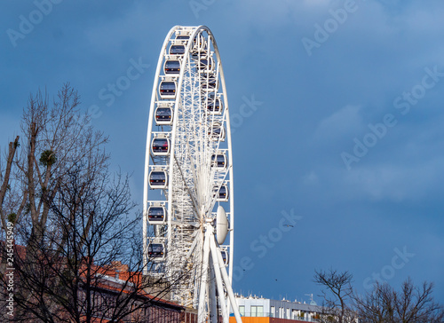 Gdansk, Poland , Ferris wheel on a background of blue sky.