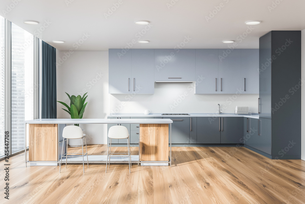 Light gray kitchen with wooden bar Light gray kitchen with wooden bar
