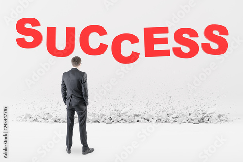 Businessman in glasses looking at success