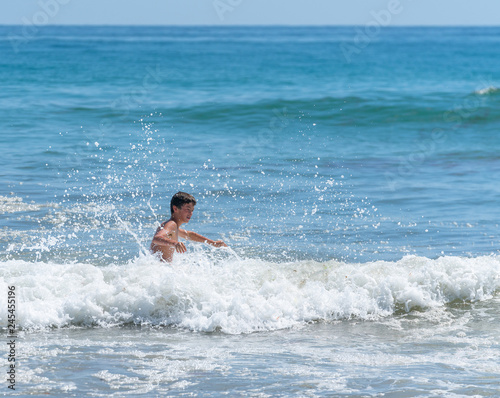 Boy playing surf. © Brian Scantlebury