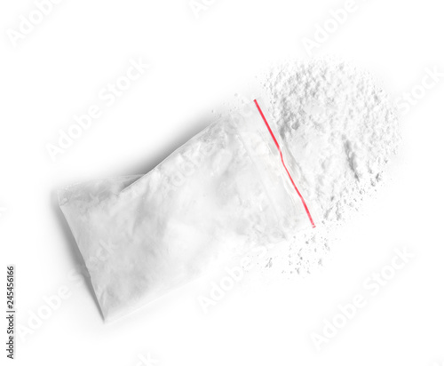Cocaine in plastic bag on white background, top view