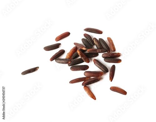 Uncooked black rice on white background, top view