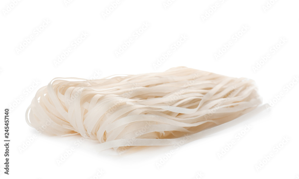 Raw rice noodles on white background. Delicious pasta Raw rice noodles on white background. Delicious pasta