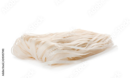 Raw rice noodles on white background. Delicious pasta
