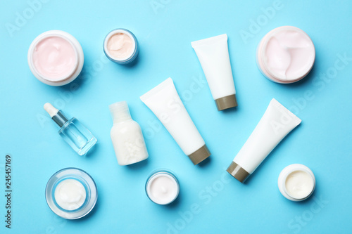 Flat lay composition with body care products on color background