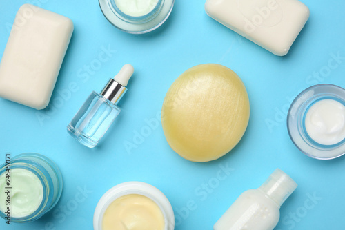 Flat lay composition with body care products on color background