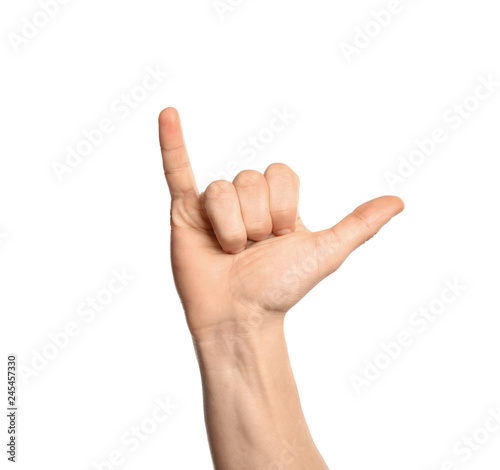 Man showing Y letter on white background, closeup. Sign language