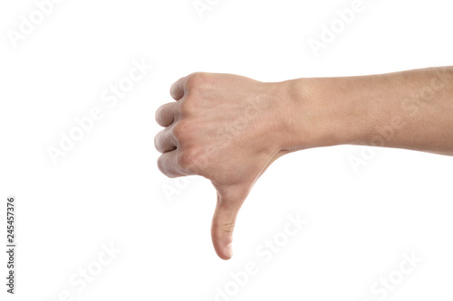 Man showing thumb down sign on white background, closeup. Body language
