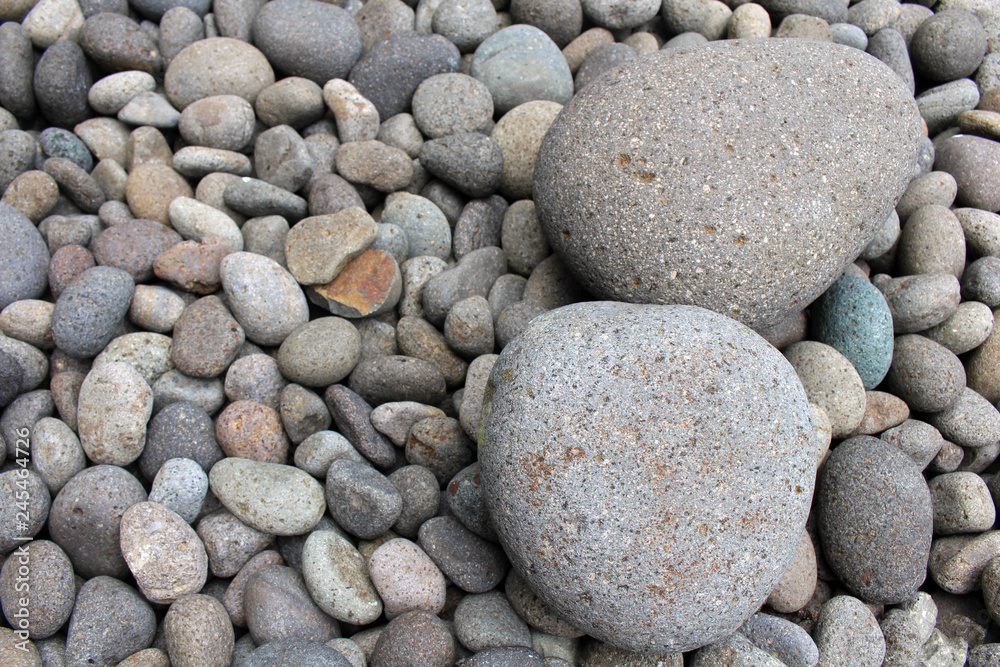 Big stones among smaller pebbles, in the garden Big stones among smaller pebbles, in the garden