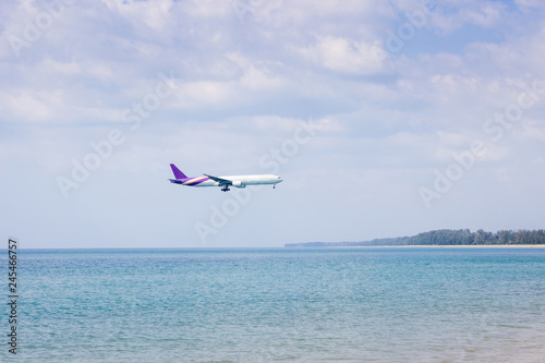 Airplane flying over sea at Phuket Thailand
