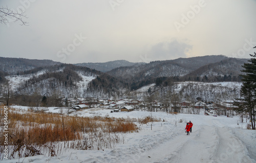 Woman walking at snow village in China