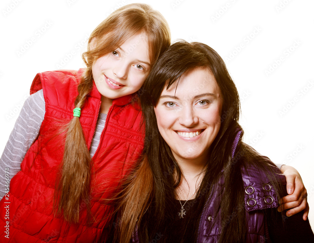 mother and her daughter smiling at the camera mother and her daughter smiling at the camera