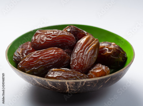 Pile of sweet tasty dried dates fruits close up isolated