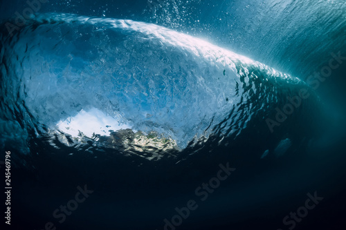 Barrel wave crashing in ocean. Underwater wave texture.