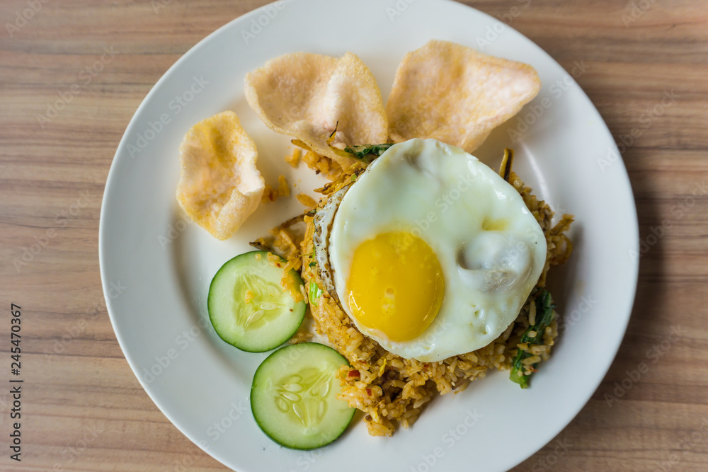 delicious fried rice and fried egg on the top serve on plate delicious fried rice and fried egg on the top serve on plate
