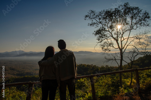 silhouette of a couple on sunrise background in the morning. copy space for text. happiness concept. as valentine's day concept