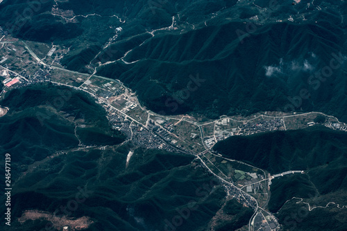 aerial view of town and green mountains