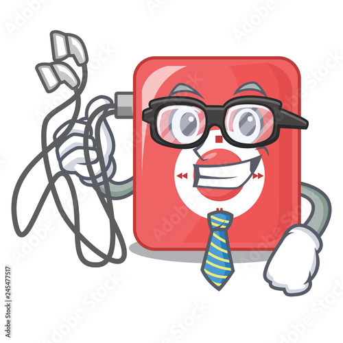 Businessman charcter mp3 player above wooden table