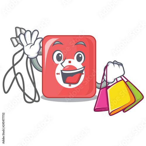 Shopping charcter mp3 player above wooden table