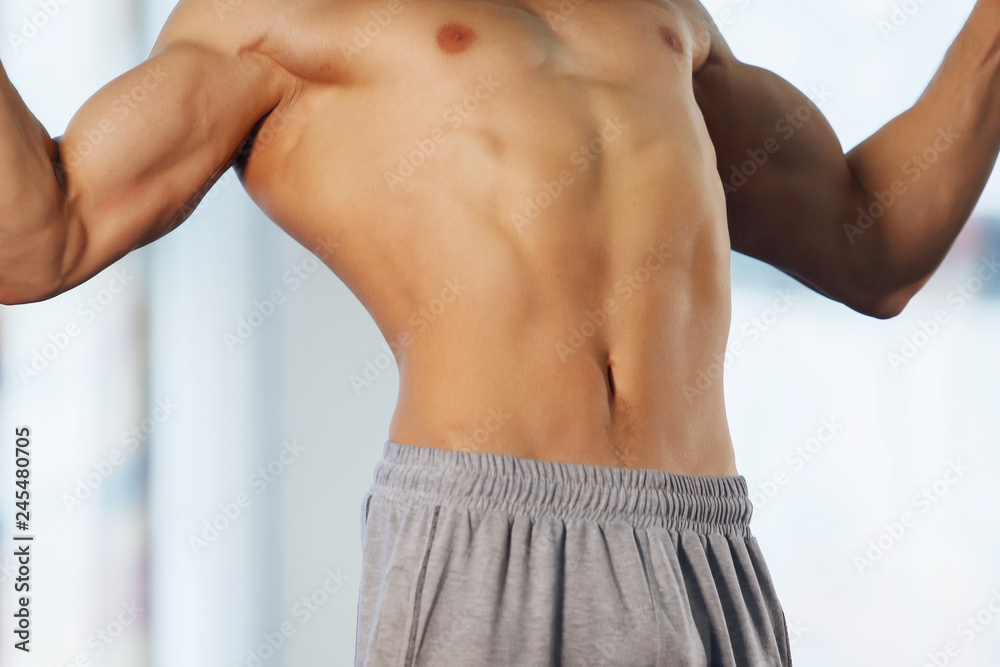 Fototapeta premium Man making exercises on crossbar.