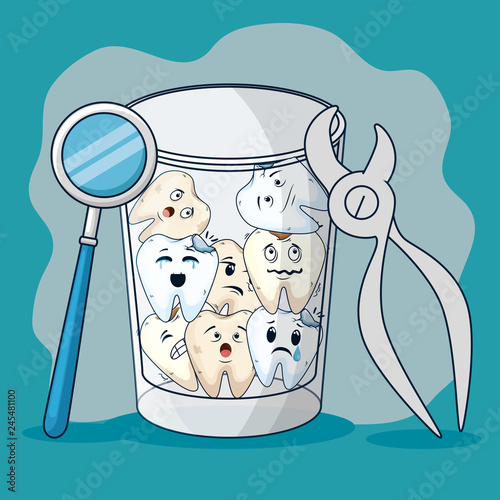 teeth in the glass with mouth mirror and dental extractor