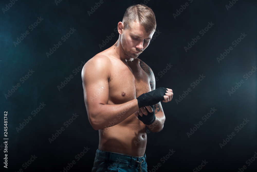 MMA Fighter Preparing Bandages For Training.