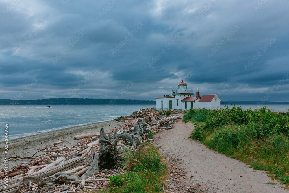 Path leading to the Victorian-era lighthouse in Discovery Park, Seattle, USA