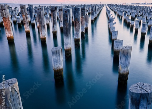 A old disassembled pier with pylons left behind