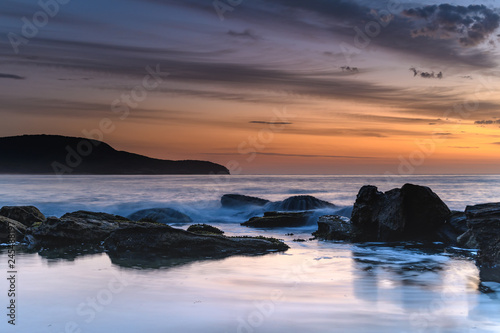 Soft Streaky High Cloud Dawn Seascape with Rocks © Merrillie