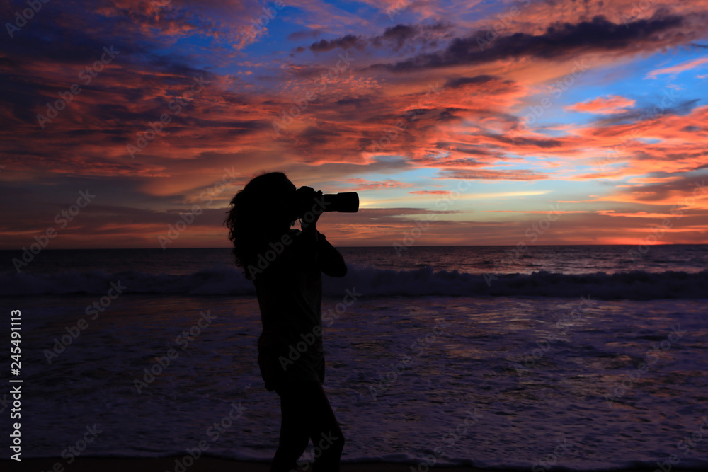 Girl Photographer Taking Pictures With Dslr Camera At Sunset On The Beach