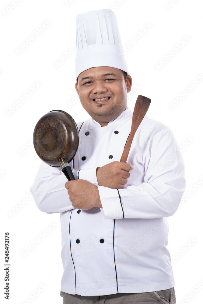 portrait of master chef pose crossed hands with pan and spatula portrait of master chef pose crossed hands with pan and spatula