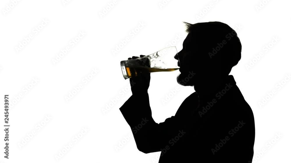 Guy drinks a glass of beer. Side view. Silhouette White background Guy drinks a glass of beer. Side view. Silhouette White background