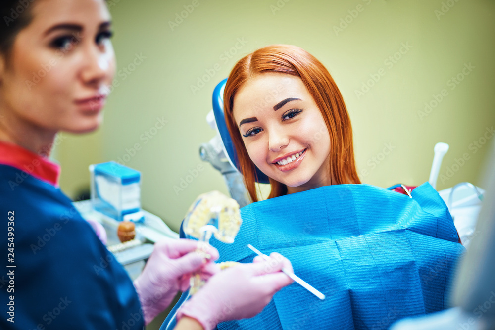 Dentist examining a patient's teeth in the dentist. Dentist examining a patient's teeth in the dentist.