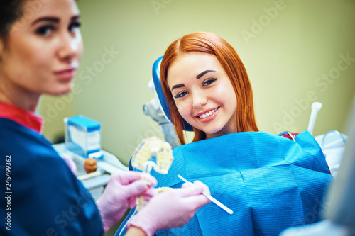 Dentist examining a patient s teeth in the dentist.