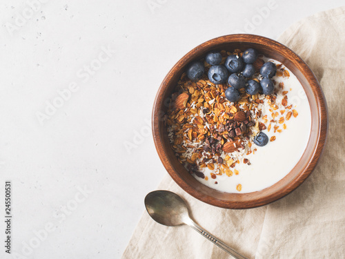 Homemade granola muesli with blueberries on white background breakfast