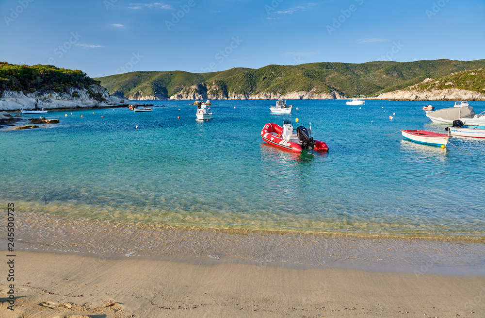 Rocky beach with boats landscape, Sithonia, Greece