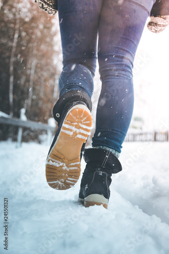 Girl is walking on snow, wintertime, cutout