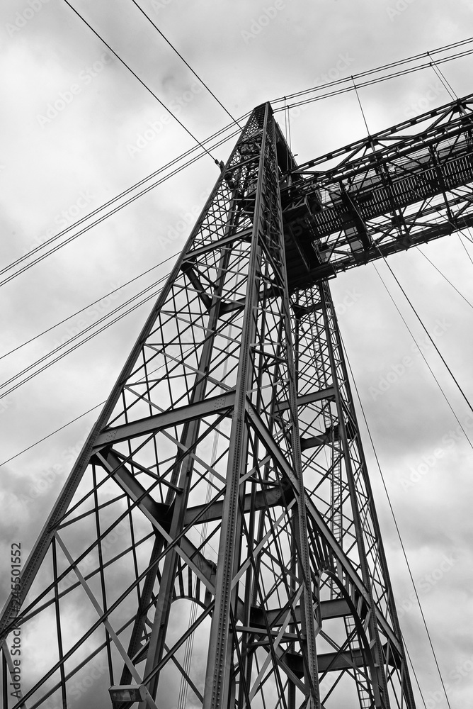 the suspension bridge of bizkaia (puente de vizcaya) between getxo and portugalete over the ria de bilbao, black and white the suspension bridge of bizkaia (puente de vizcaya) between getxo and portugalete over the ria de bilbao, black and white