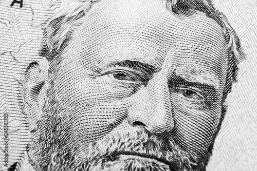 Close up view Portrait of Ulysses S. Grant on the one fifty dollar bill. Background of the money. 50 dollar bill with Ulysses S. Grant eyes macro shot. Money background. Face portrait. Black and white