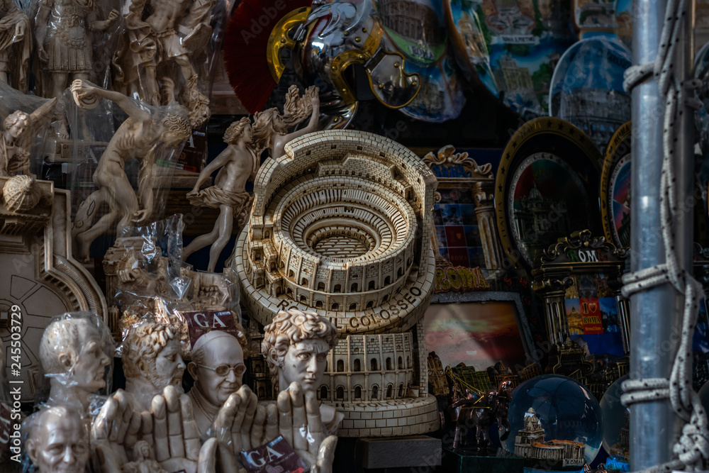 Fototapeta premium Souvenirs and magnets with Colosseum in Rome