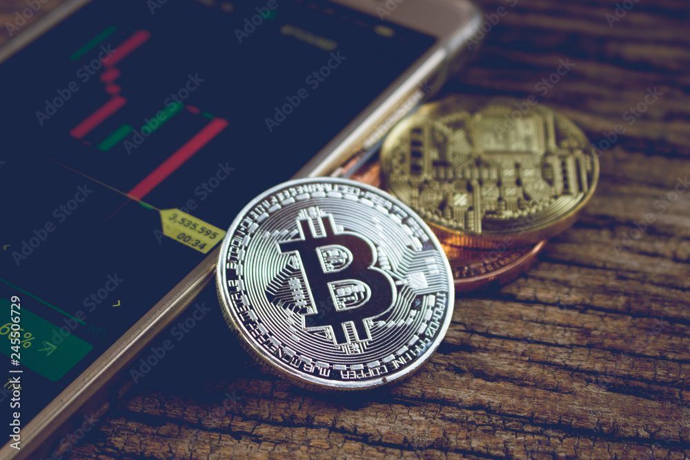 bitcoin investment concept for trade article,image of bitcoin with graph and mobile. bitcoin investment concept for trade article,image of bitcoin with graph and mobile.