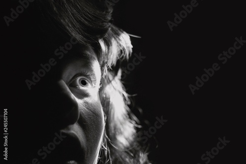 Black and white portrait of a scared woman - panic