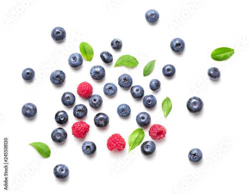 top view of blueberry and rapsberry fruits isolated on white background