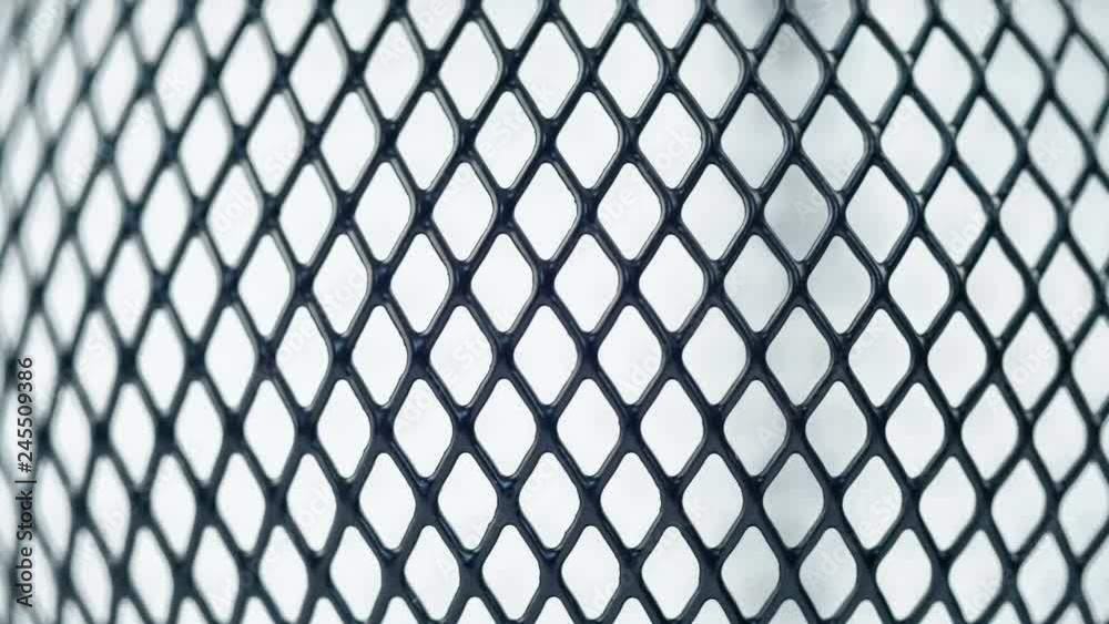 Black grid rotating on white background. Close up macro 4k footage. Black grid rotating on white background. Close up macro 4k footage.