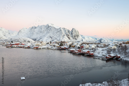 Landscape of dishing house village among the snow with mountain view in Lofoten island Reine Norway